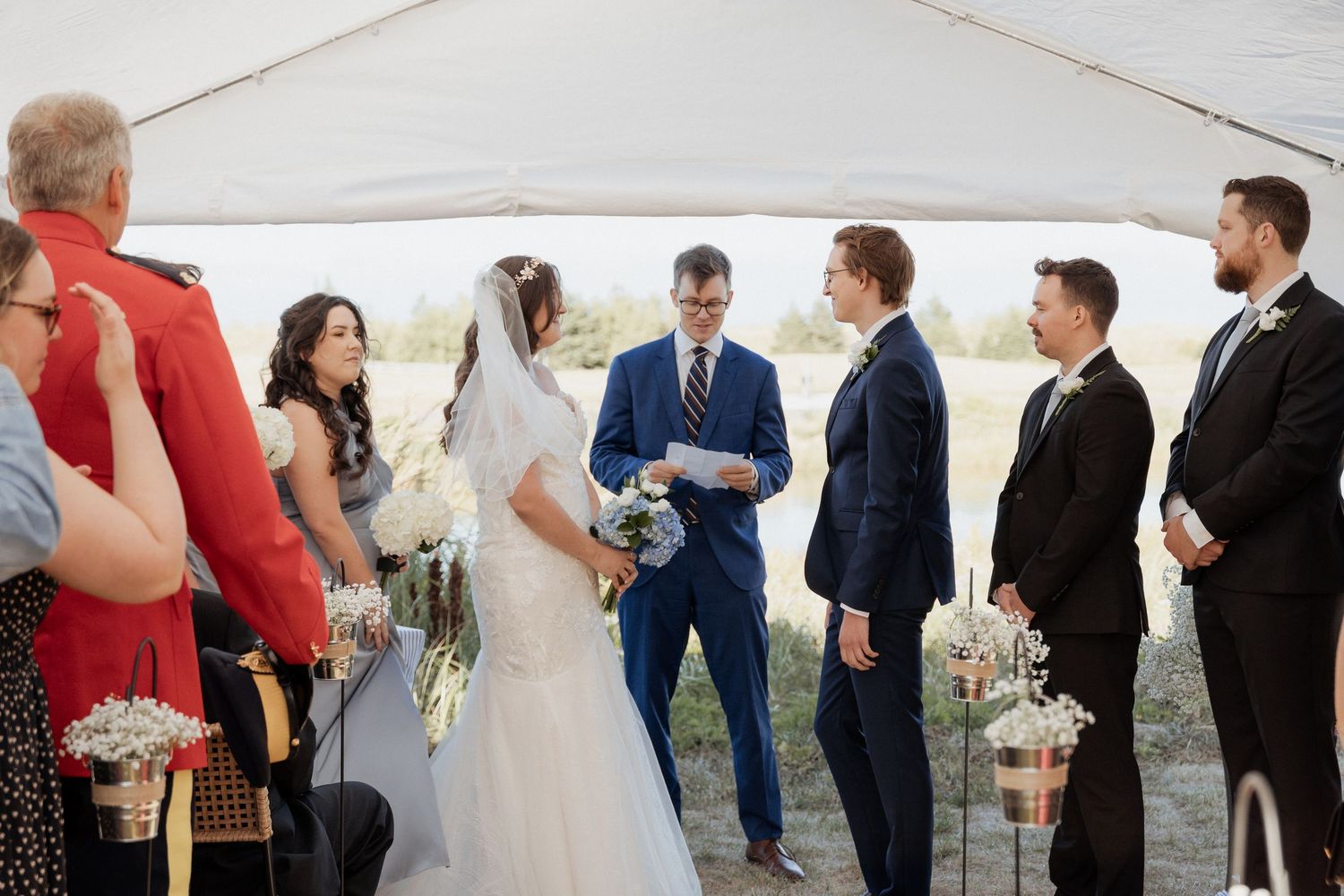 bride and groom wedding ceremony outdoor summer tent wedding Parlee Beach photographer New Brunswick Shediac wedding photographer