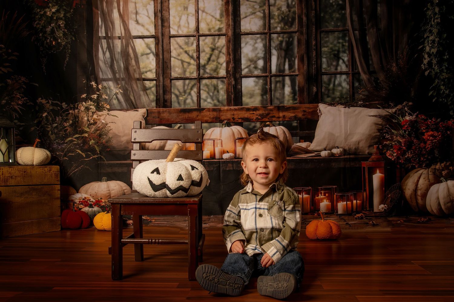 A cozy autumn porch decorated with pumpkins, throw pillows, blankets and Halloween decor creates a festive fall scene.