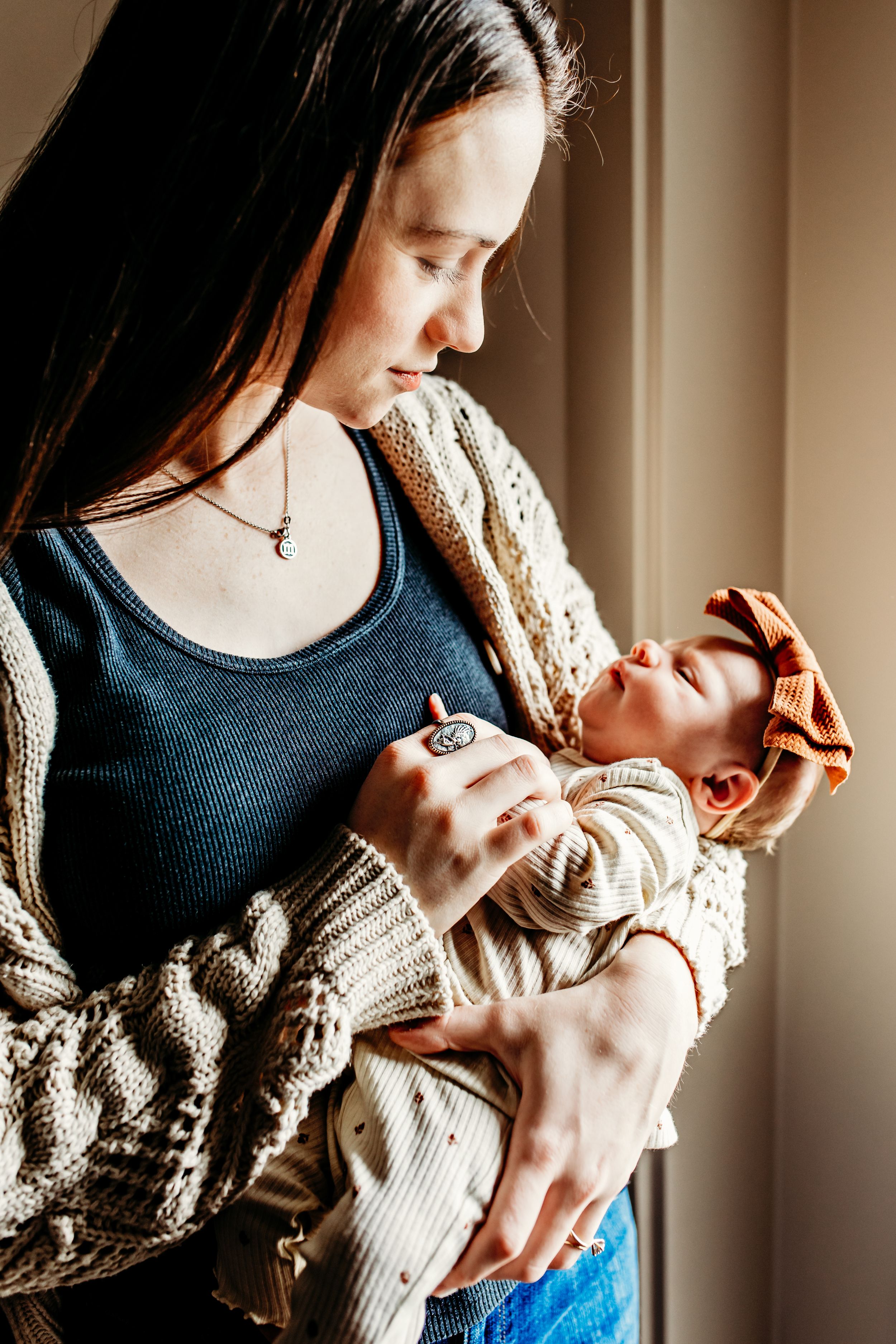 Three intimate photos of tender nurturing and bonding moments in warm, natural window light.