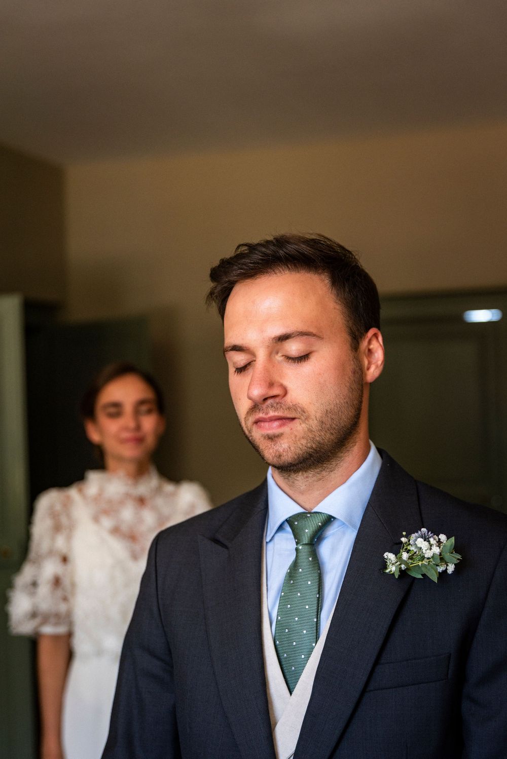 Wedding preparations show a formal scene with suits, ties and floral boutonnieres.