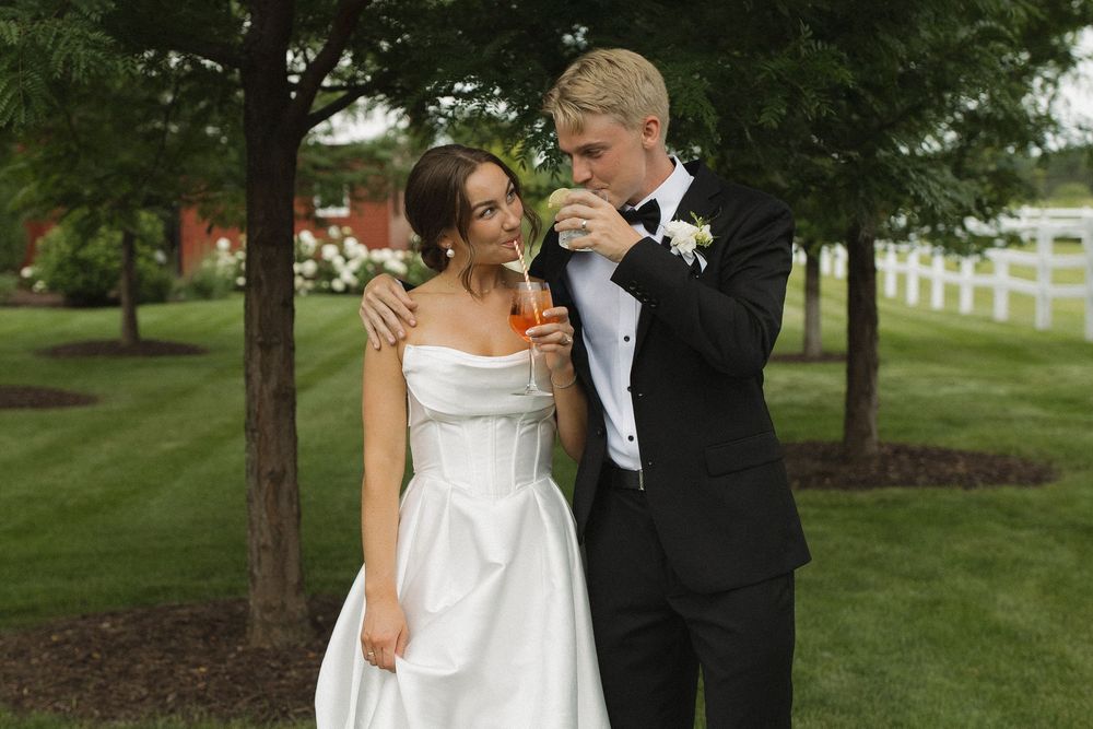 Couple sharing an intimate moment during their outdoor wedding celebration.