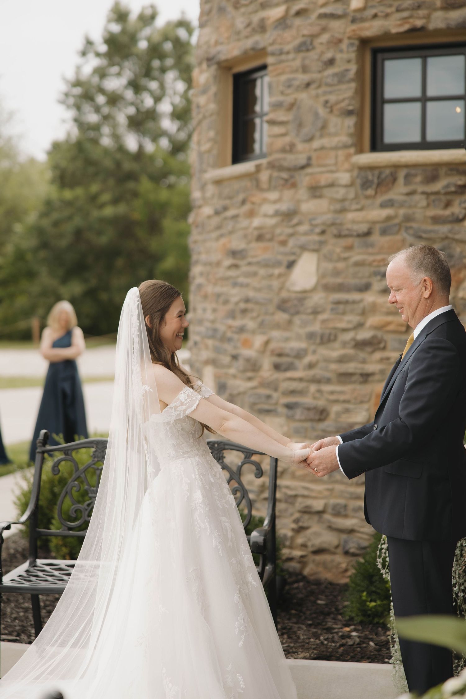 First look wedding moment captured in sequence showing couple's emotional reaction at stone building.