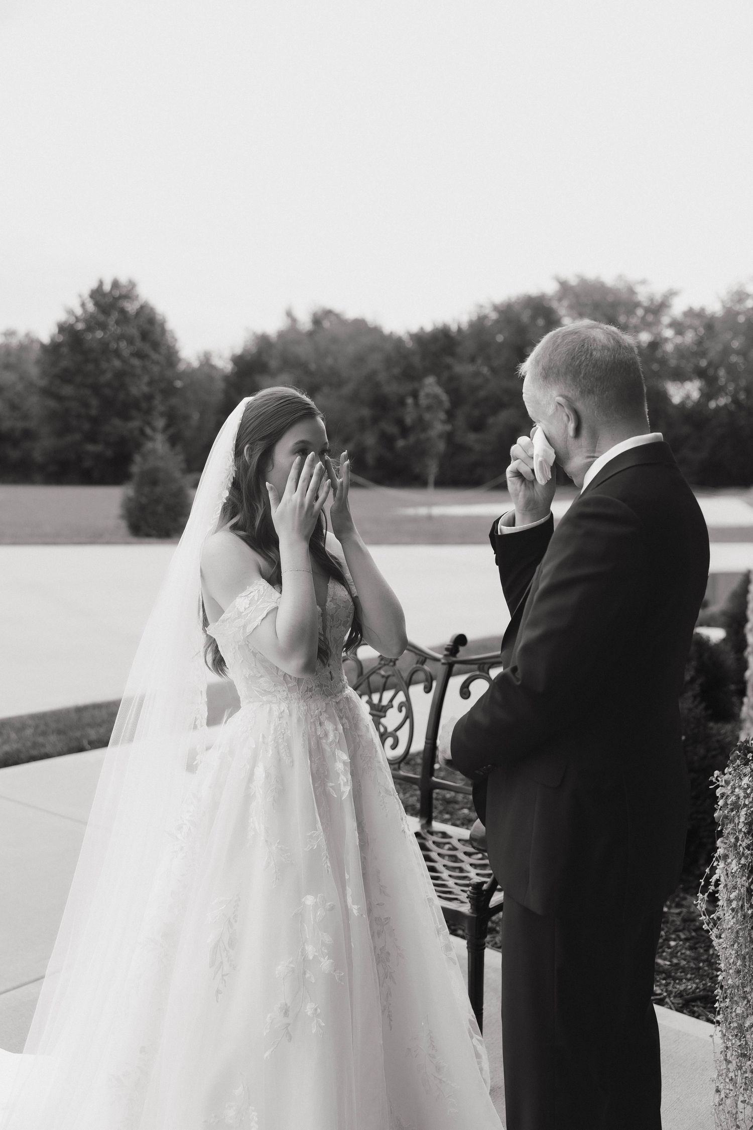 Series of wedding photos showing artistic black and white first look moments between a bride and groom.