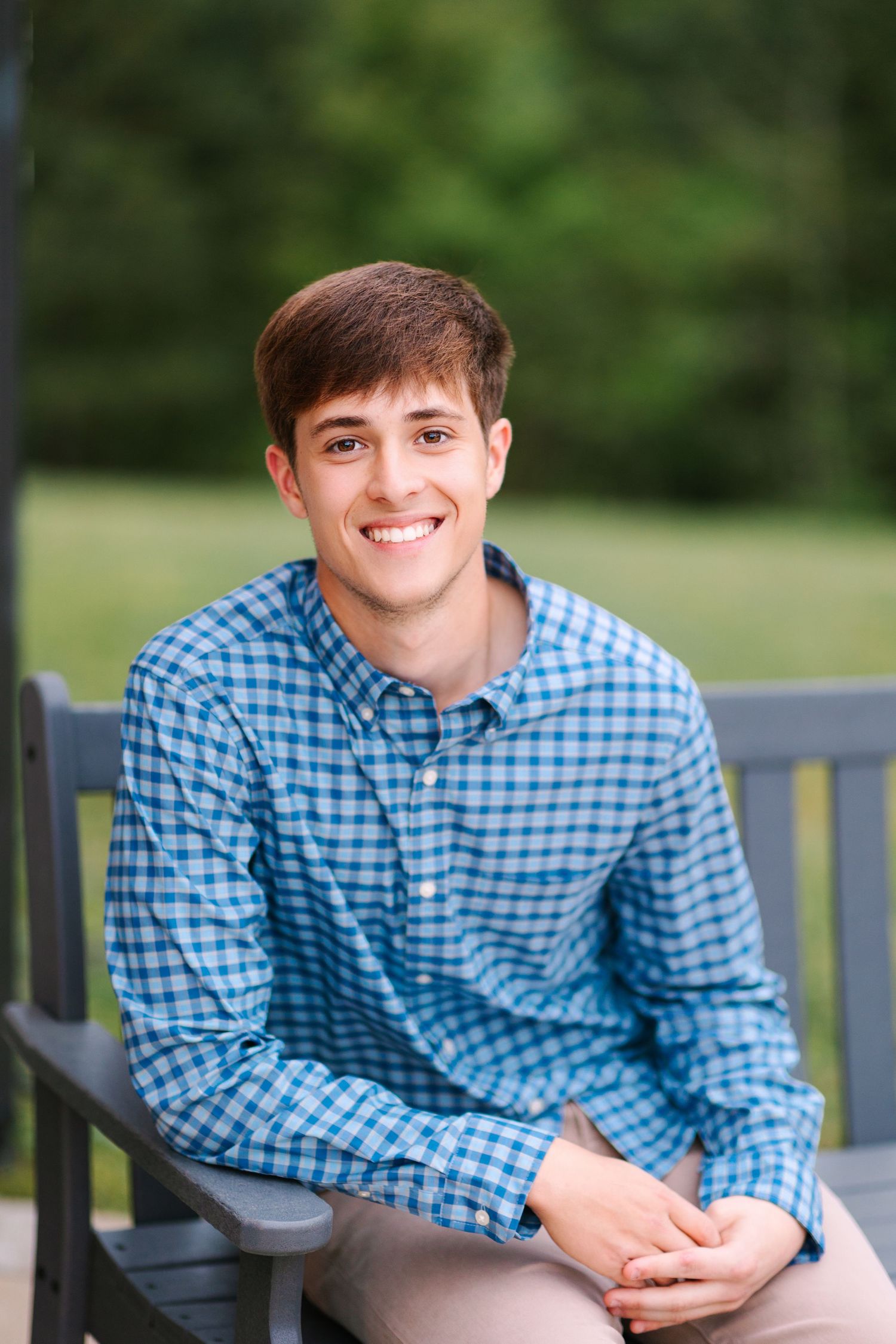 A series of casual outdoor portraits showing someone in a blue checkered shirt sitting on a bench with greenery in background.