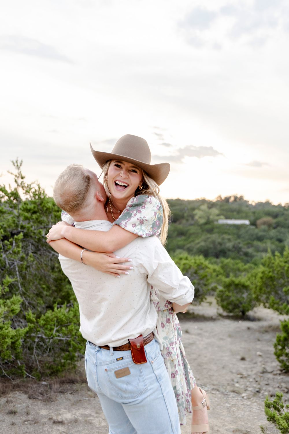 Sydney’s joyful reaction to her surprise engagement in Dripping Springs, Texas Hill Country.