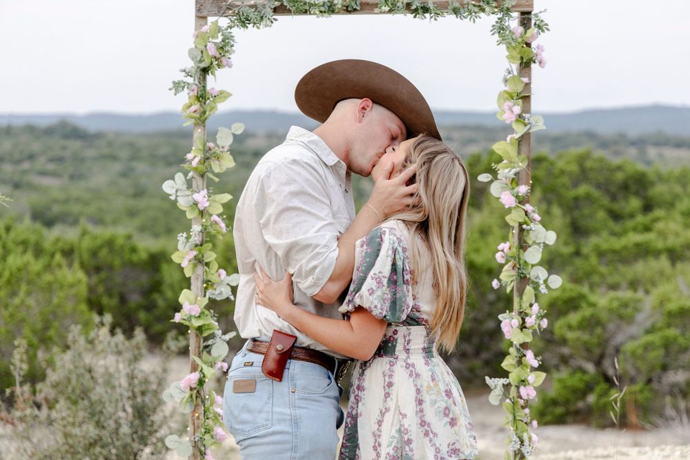 Handmade rustic arch decorated for a surprise proposal in Dripping Springs, Texas.