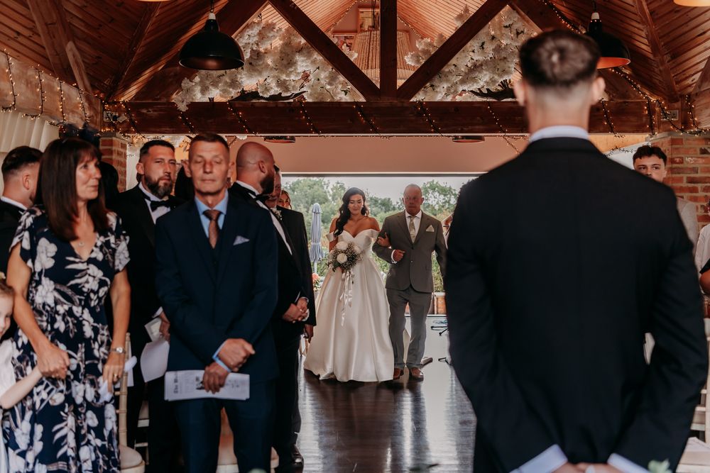 Nine diverse photos show moments from a wedding celebration including dancing, toasts, and venue interior views.
