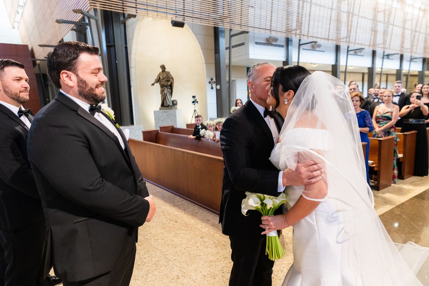 Wedding ceremony moments captured in an elegant indoor venue.