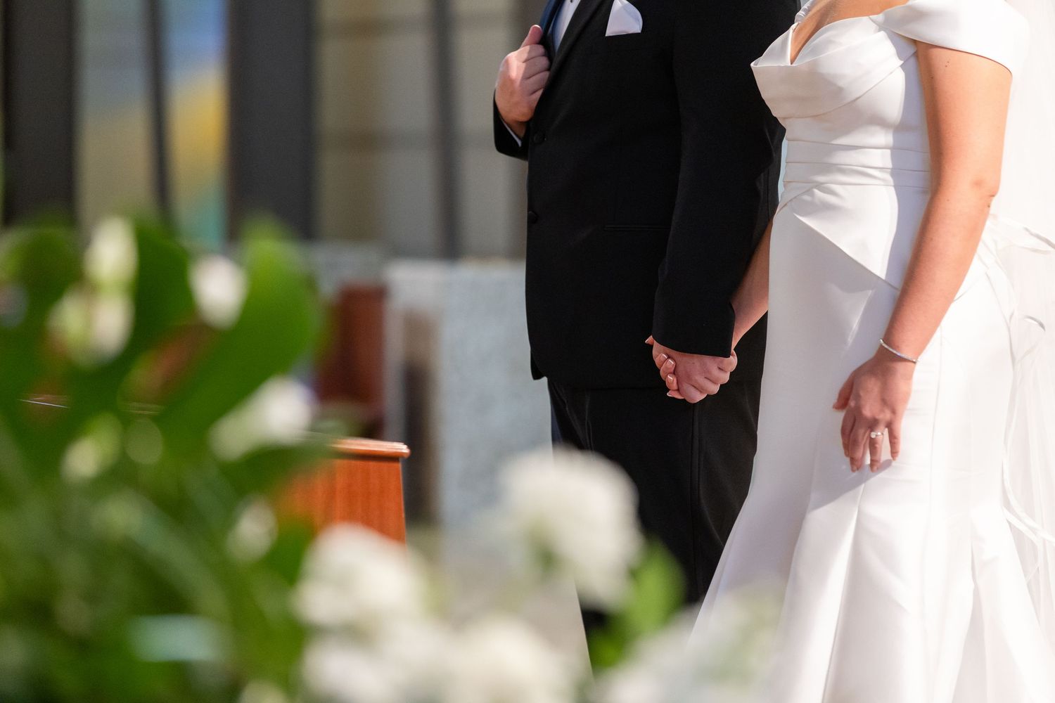 Elegant outdoor wedding ceremony with couple exchanging vows.