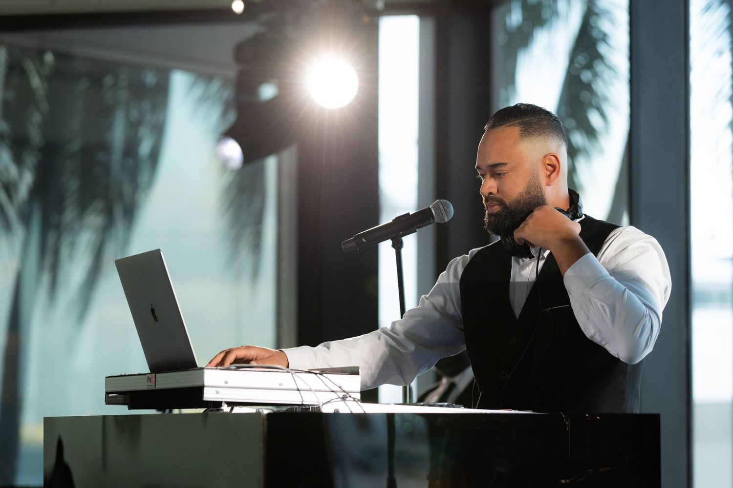 DJ booth setup at an elegant evening event venue with professional lighting.