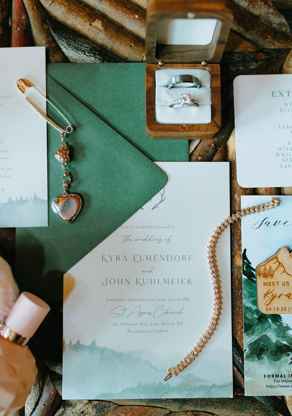 Elegant wedding invitations and stationery laid out on dark green background with decorative details.