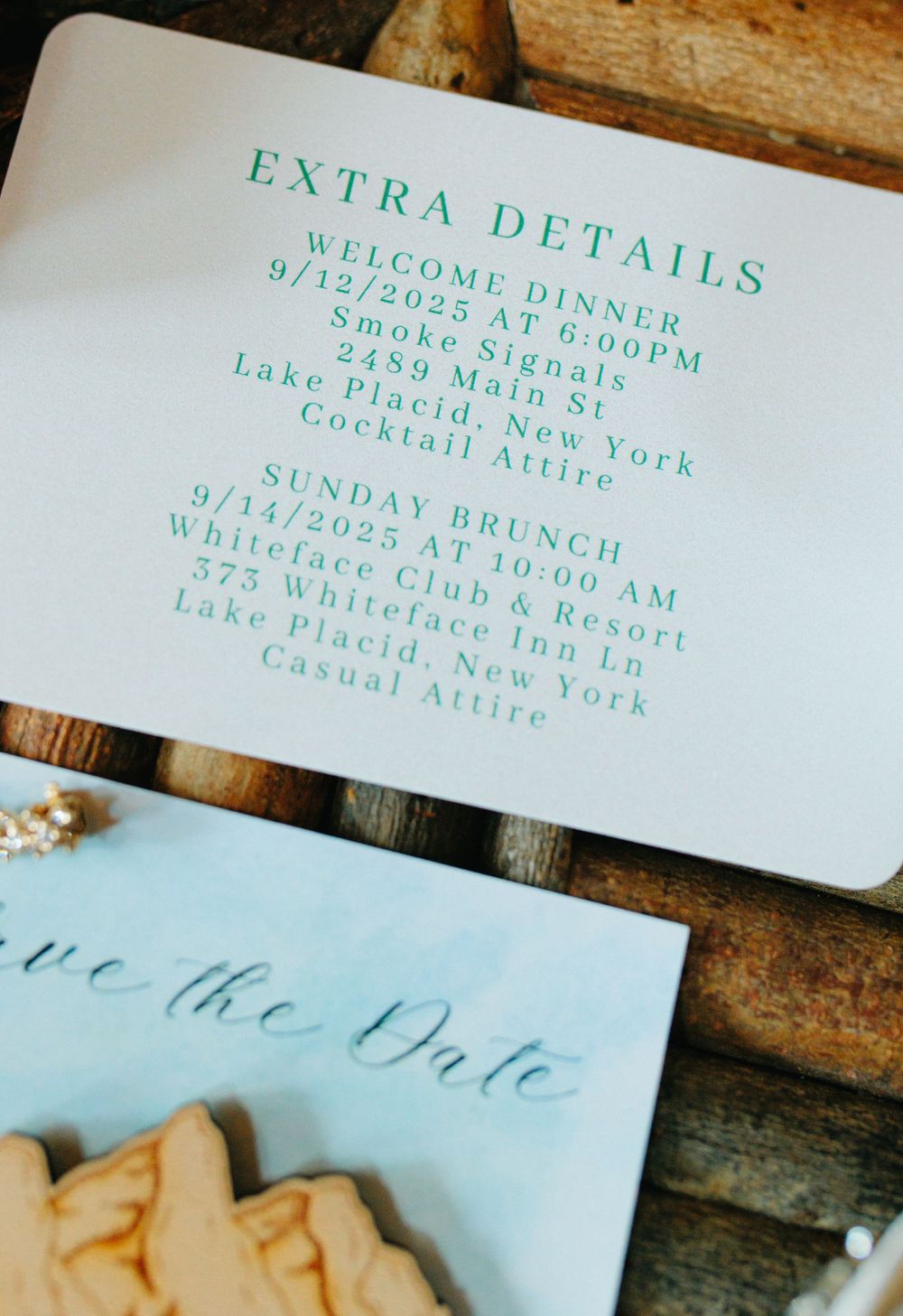 Wedding invitation details printed in mint green ink on white paper with elegant calligraphy.
