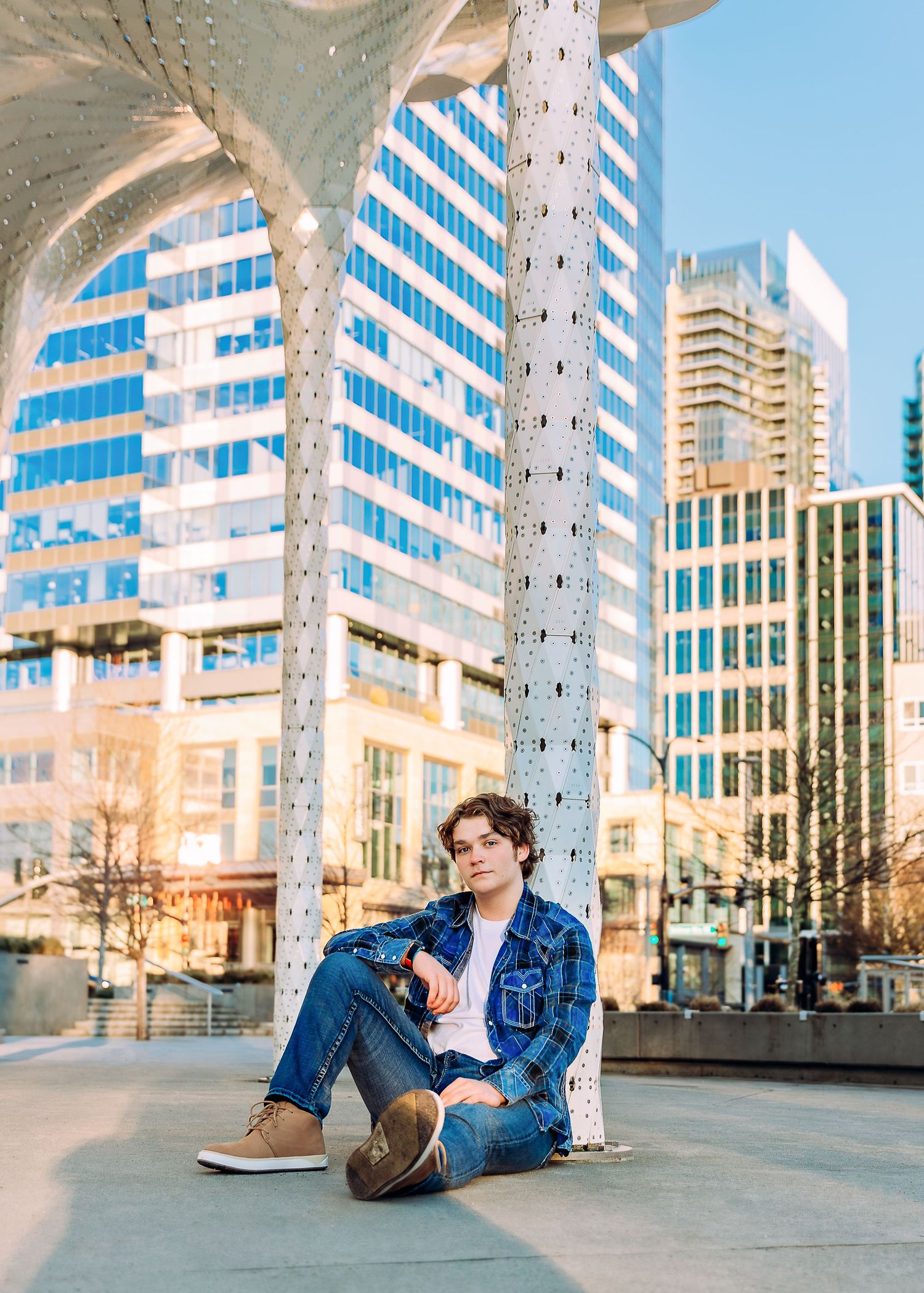 Urban architectural photoshoot featuring modern glass buildings and concrete structures.