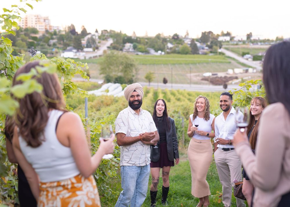 Winemaker and owner of Little Straw Winery leading vineyard tour for guests - Okanagan winery brand photography by Tania Veitch.