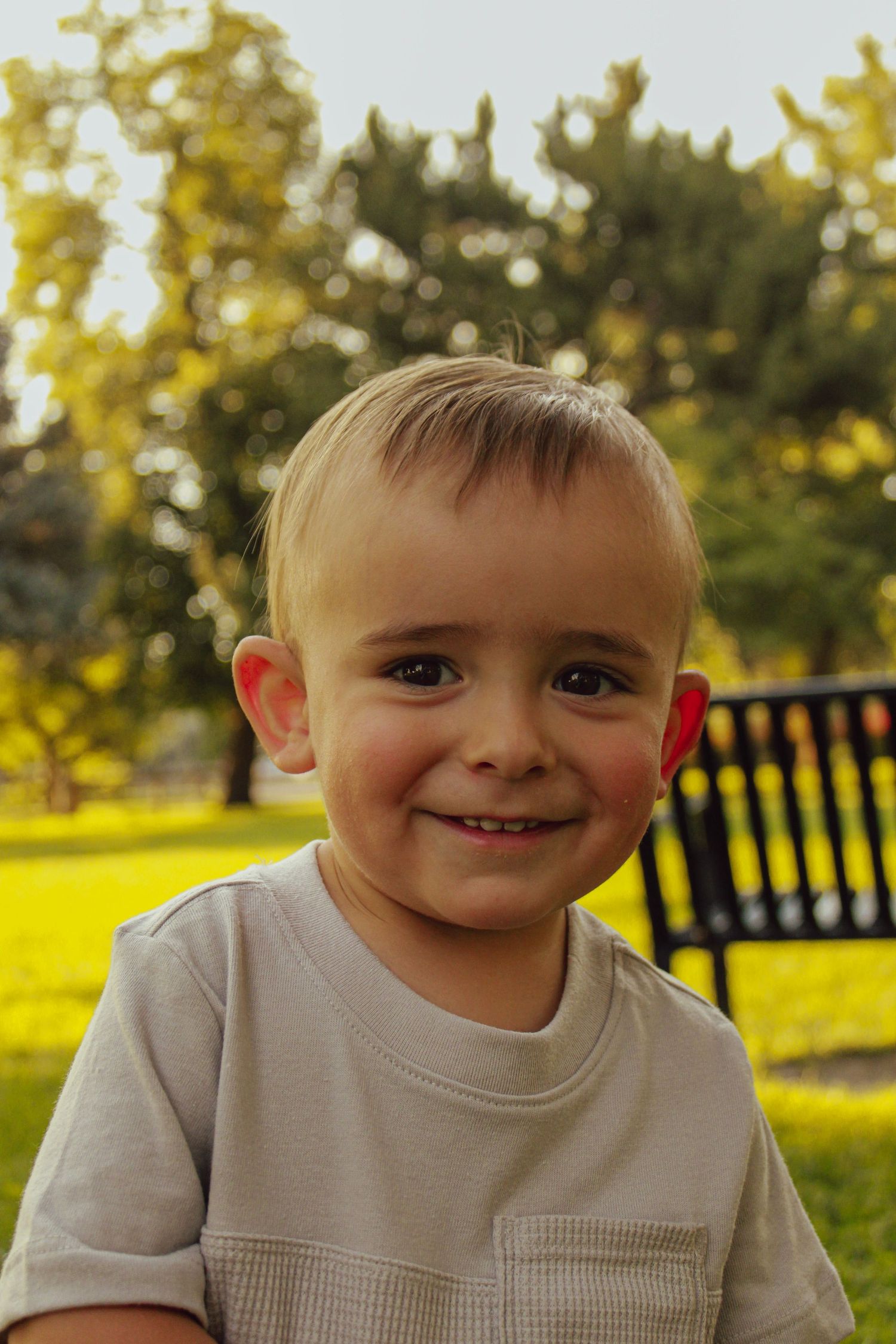 Close-up outdoor portrait series showing cheerful expressions in natural sunlight.