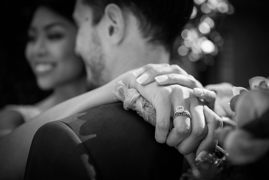 Black and white panoramic image showing multiple couples dancing and celebrating at an elegant event.