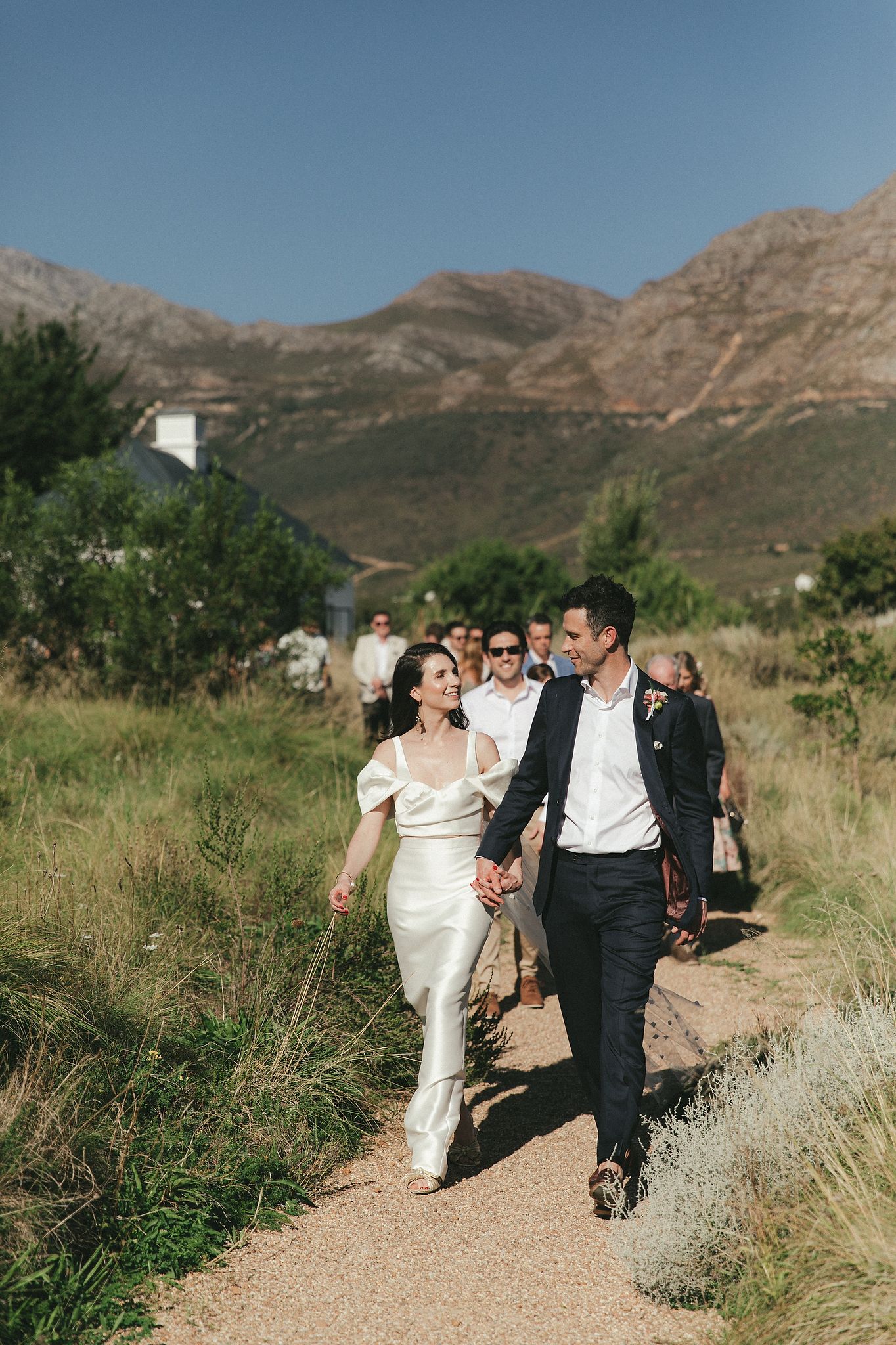 Bride and groom portraits at La Cotte in Franschhoek with mountain views