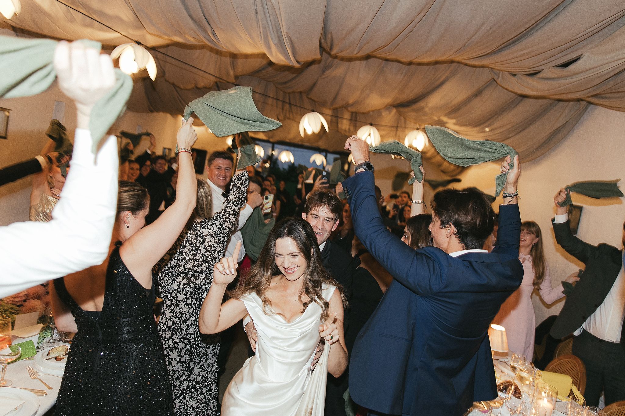 Evening reception at La Cotte with tables, candles, and dancing guests