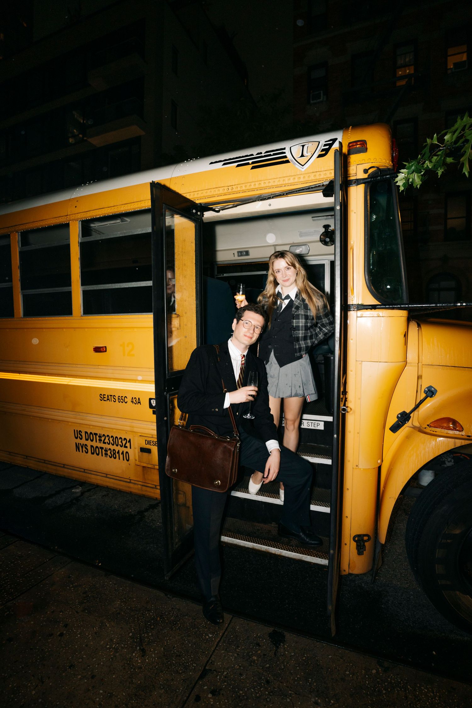 Nighttime scenes of people entering and exiting a yellow school bus in low light conditions.