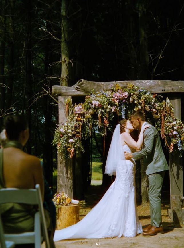 A romantic wedding ceremony takes place at sanaview near pittsburgh pa caught on 35mm film photography.