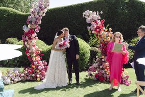 Outdoor ceremony setup at Johannesdal 1207 with white chairs and floral aisle