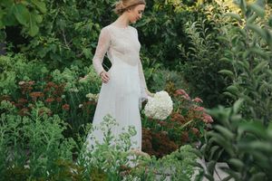Bride walking through the gardens of Johannesdal 1207 wedding venue