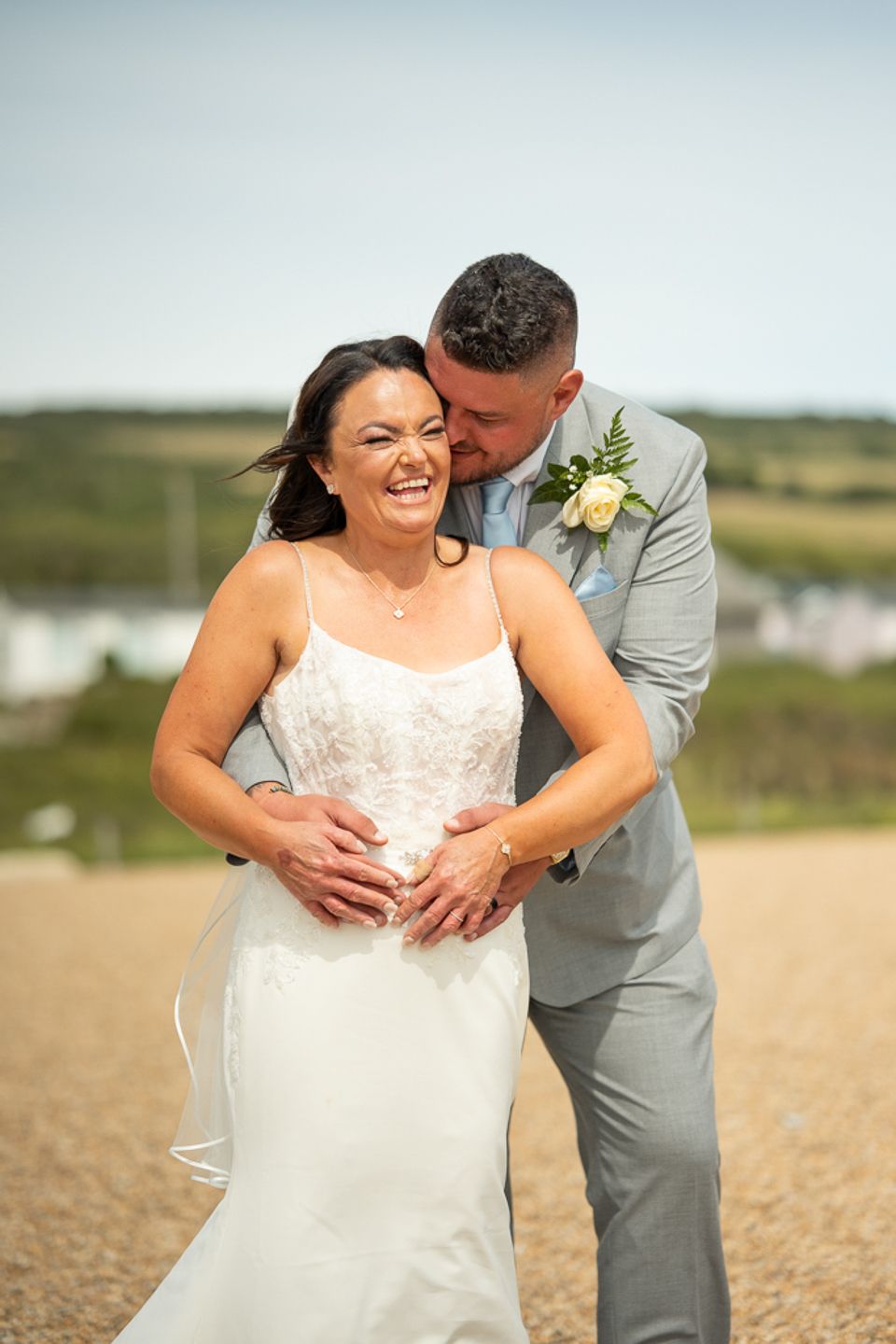 Dorset Wedding photographer, Kris the photographer, capturing a wedding on a Dorset beach