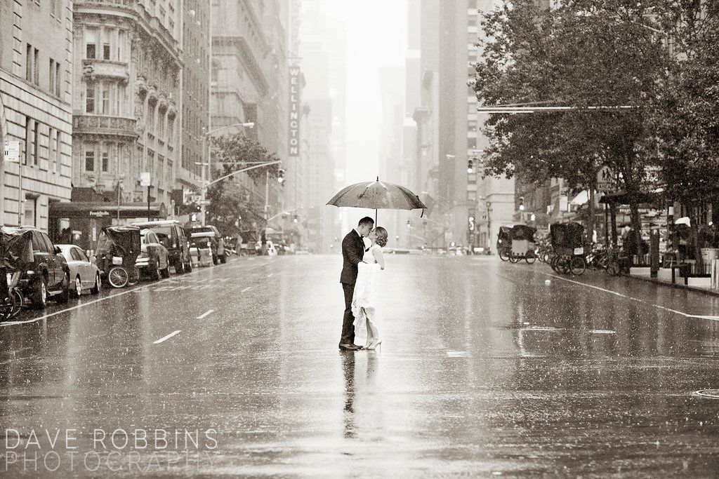 A series of black and white photographs showing people with umbrellas walking in the rain on city streets.