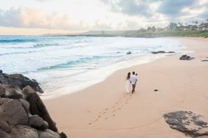 Maui family photographer photo against beautiful Maui beach cliff sunrise by ohwowfotos.
