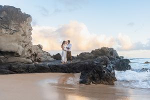 Maui family photographer photo against beautiful Maui beach cliff sunrise by ohwowfotos.