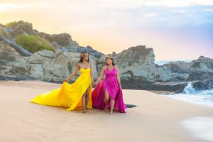 Maui flying dress photographer photo against beautiful Maui beach cliff by ohwowfotos.