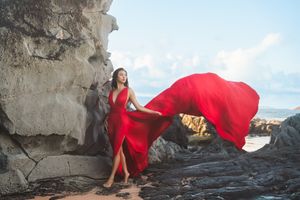 Maui flying dress photographer photo against beautiful Maui beach cliff by ohwowfotos.