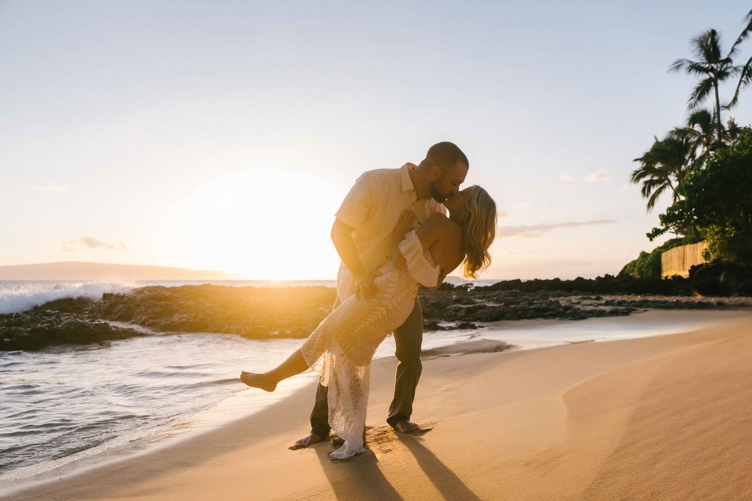 Maui couple engagement photographer photo against beautiful Maui sunset beach by ohwowfotos.