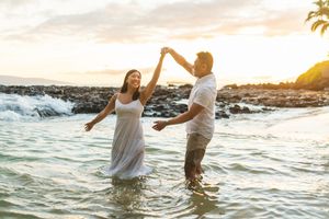 Maui couple engagement photographer photo against beautiful Maui sunset beach by ohwowfotos.