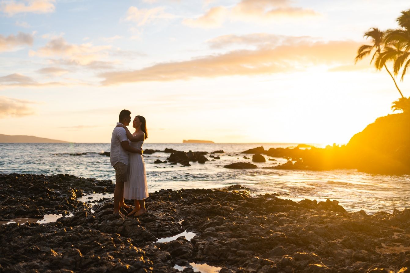 Maui couple engagement photographer photo against beautiful Maui sunset beach by ohwowfotos.