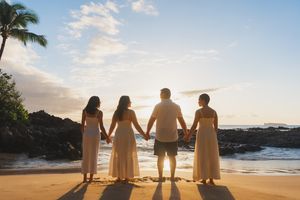 Maui family photographer photo against beautiful Maui sunset beach by ohwowfotos.