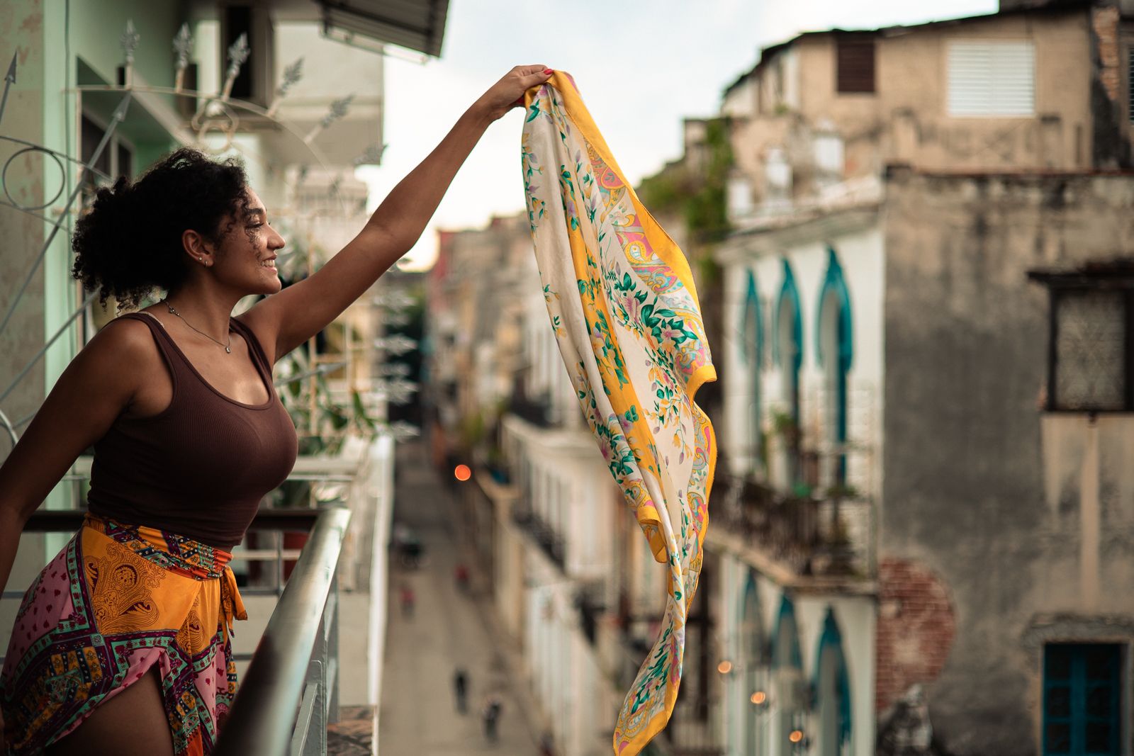 Balcony portrait with flowing scarf, Fort Lauderdale editorial shoot by Mannyportraits, cinematic fashion and lifestyle photography.