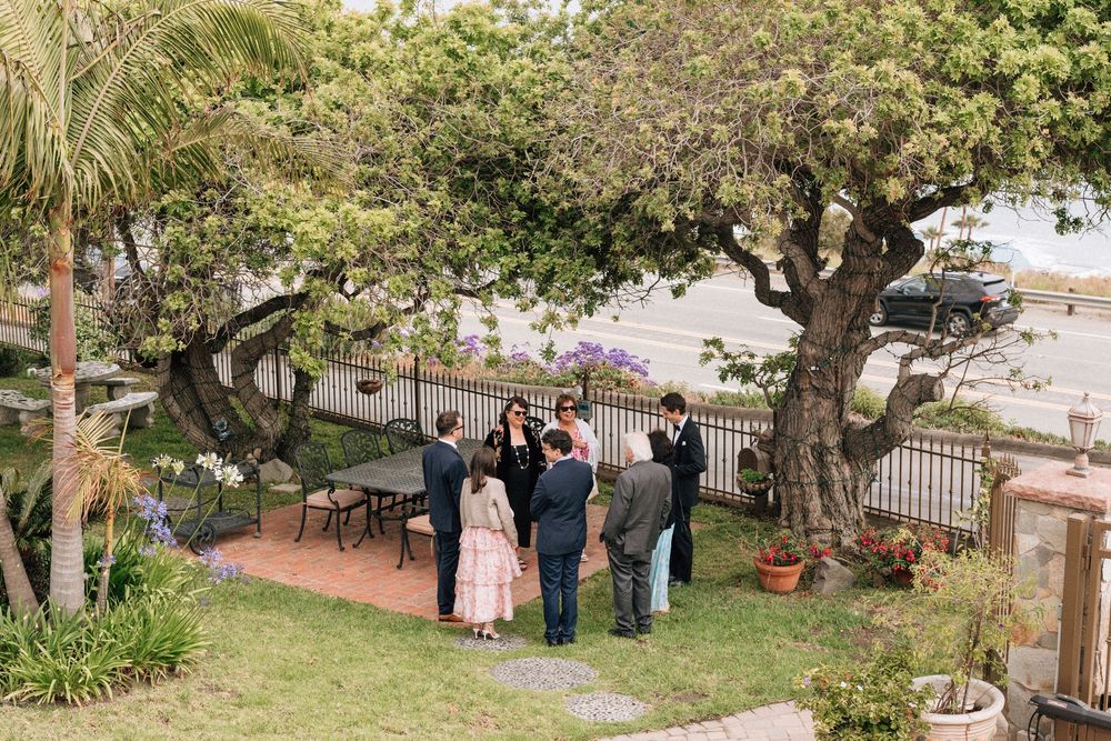 Guests gathered in a Malibu courtyard before a private wedding ceremony.
