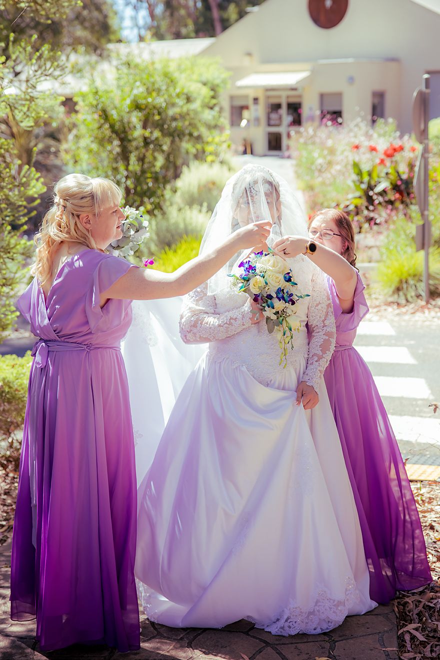 A sequence of playful moments with a bride and bridesmaids in purple dresses helping with the wedding dress outdoors.