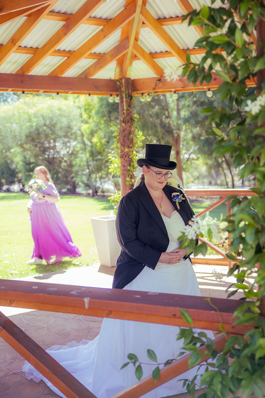 Three connected photos show someone in formal wear reading from papers at an outdoor wooden gazebo structure.