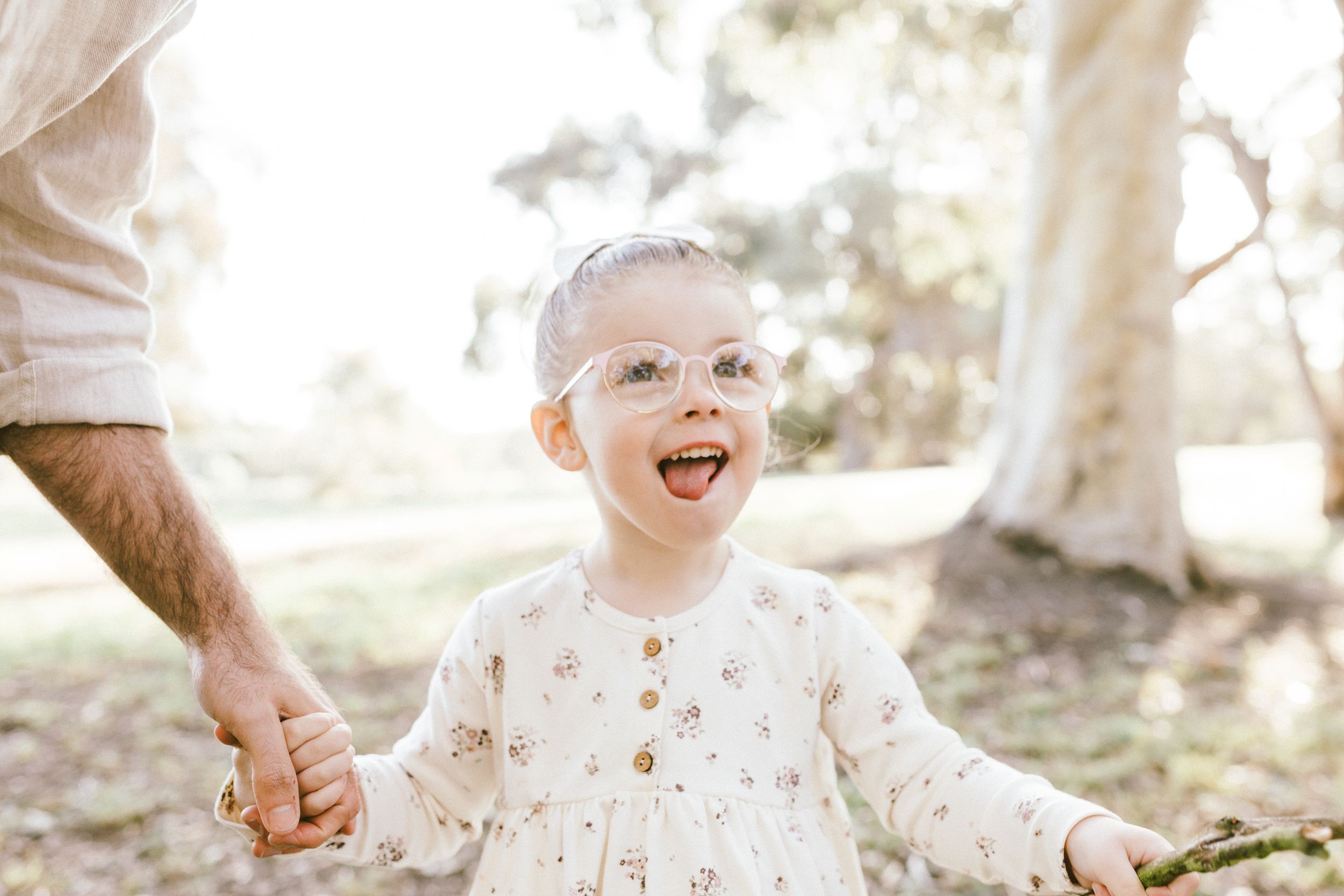 A series of candid lifestyle photos captures joyful moments outdoors in soft, natural lighting.