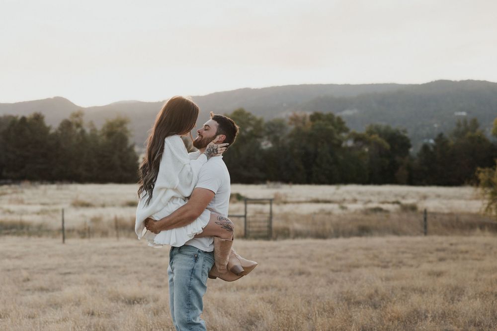 A series of romantic photos capturing a couple walking through a golden field at sunset.