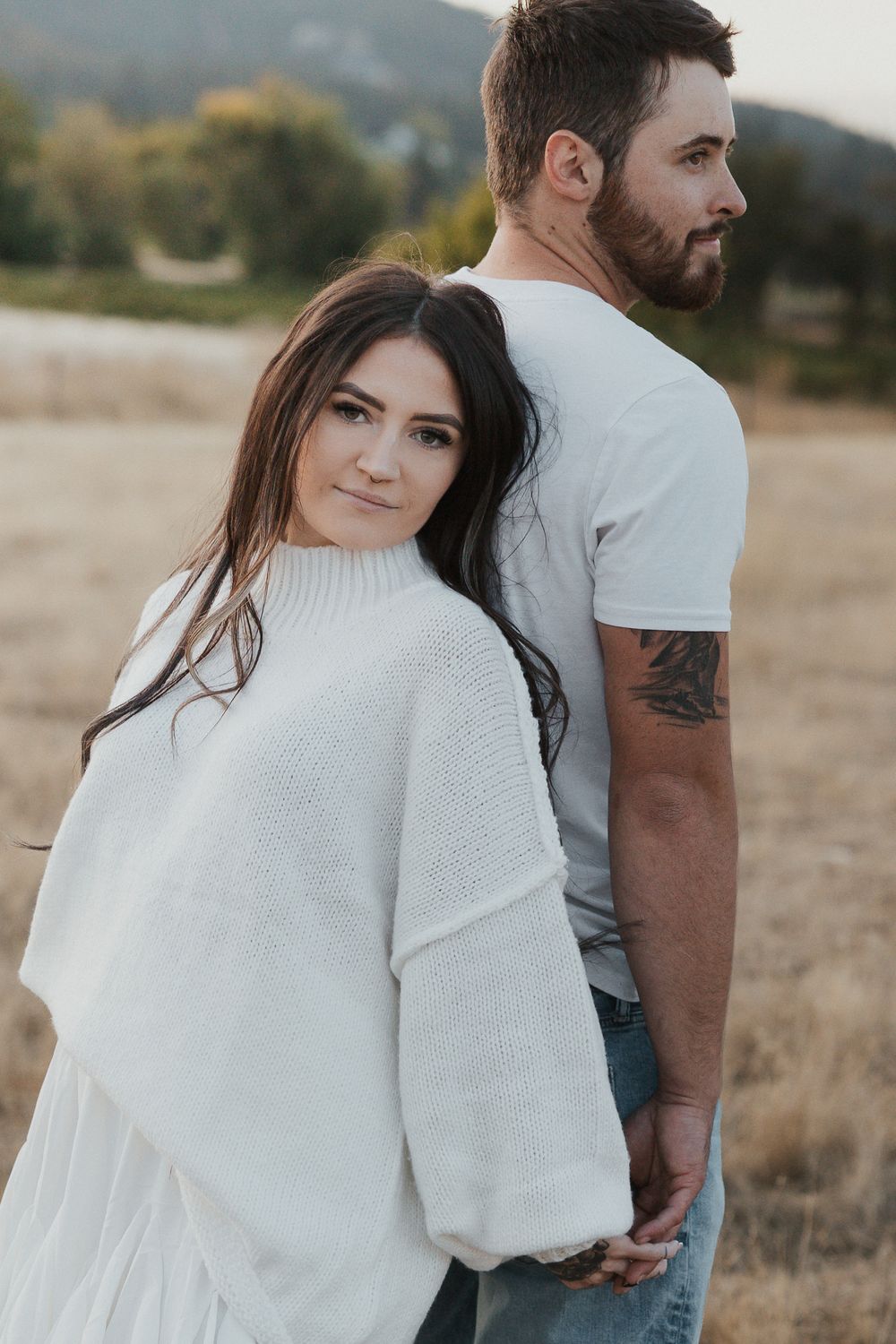 A series of intimate portraits showing a couple in white clothing against a mountainous landscape.