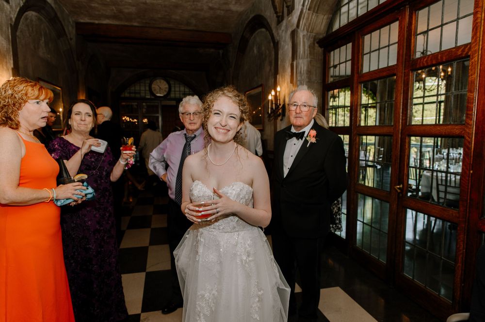 A series of wedding reception photos showing guests mingling and celebrating in a banquet hall setting.
