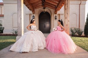 Two elegant quinceañera dresses, one in white and one in pink, photographed against a church facade.