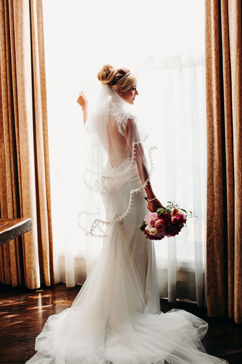 Four sequential photos show a bride in a flowing white wedding gown and veil posing elegantly near a window.