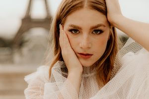 Artistic photo series featuring warm-toned portraits of a subject in soft, natural lighting.
