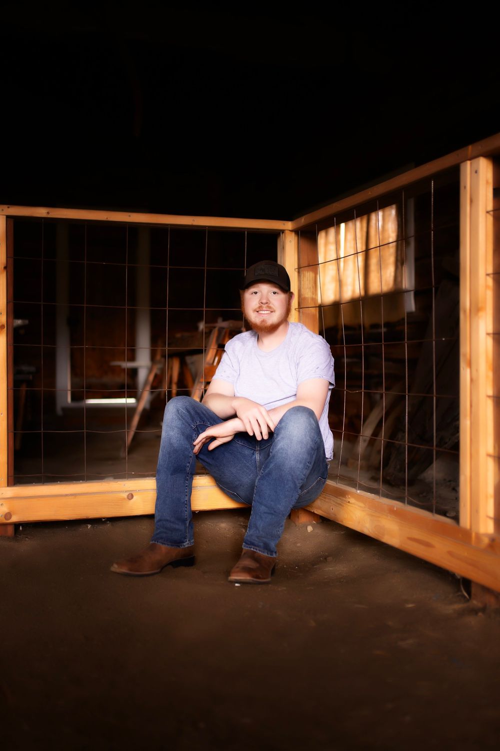 A person in jeans sits on a wooden railing in a dimly lit space, with the sequence shown in multiple frames.