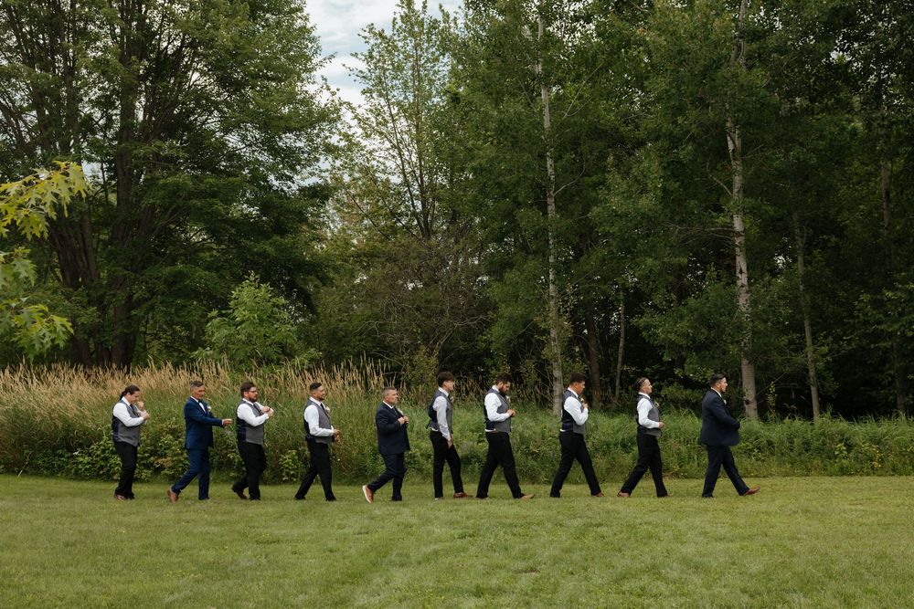 A sequence of people practicing tai chi exercises together in a peaceful outdoor park setting.