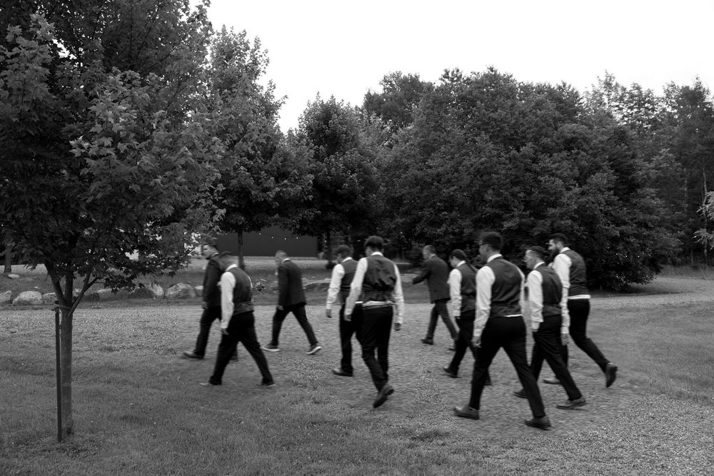 Black and white photos showing people performing synchronized tai chi movements in a row outdoors.